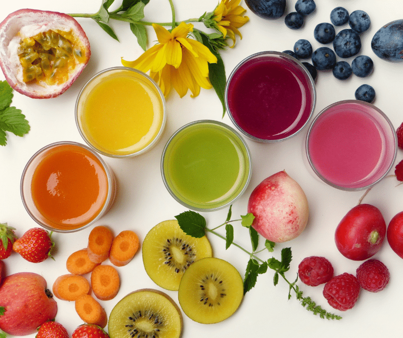 colorful smoothies and fruit