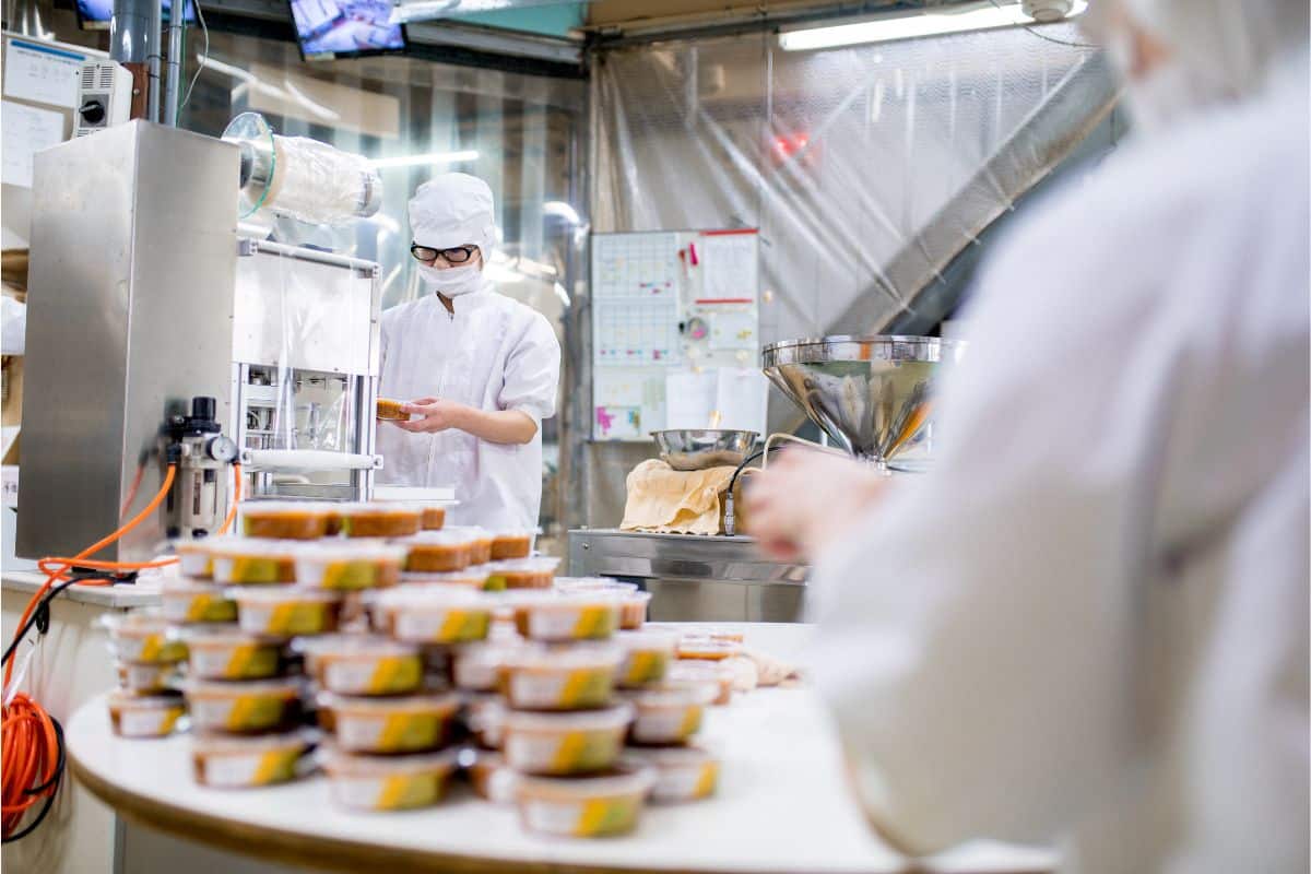Workers in a food processing facility