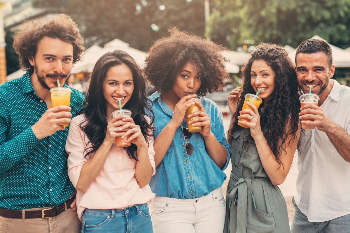 Group of friends consuming drinks together