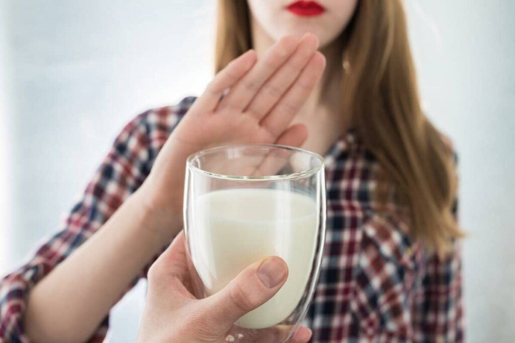 a woman with lactose intolerance saying no to milk